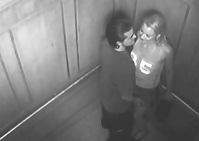 Couple fellow-feeling a amour in elevator forgot involving is a camera