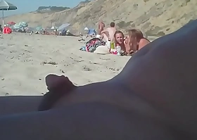 Man connected with a small penis on the nudist beach