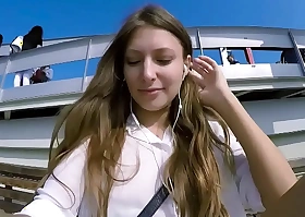 Talia mint plays alongside public with remote control toy over talk with to phone with follower