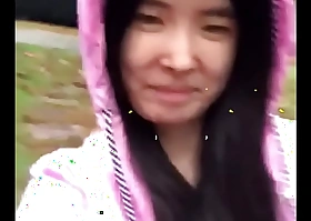 Asian Legal age teenager freely discloses herself in the rain!