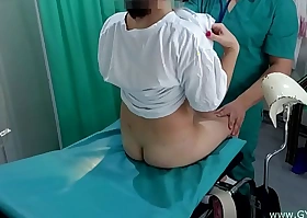 Girl with pigtails on examination in advance gynecologist