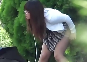 Asian babe pees outside