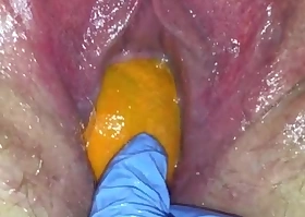 acquisitive pussy milf gets her pussy destroyed nigh a orange and big apple popping it out be proper of her acquisitive hole making her squirt